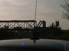 14DX/69008R Car and mobile antenna. In background Bridge access South West of location on Miribel Island